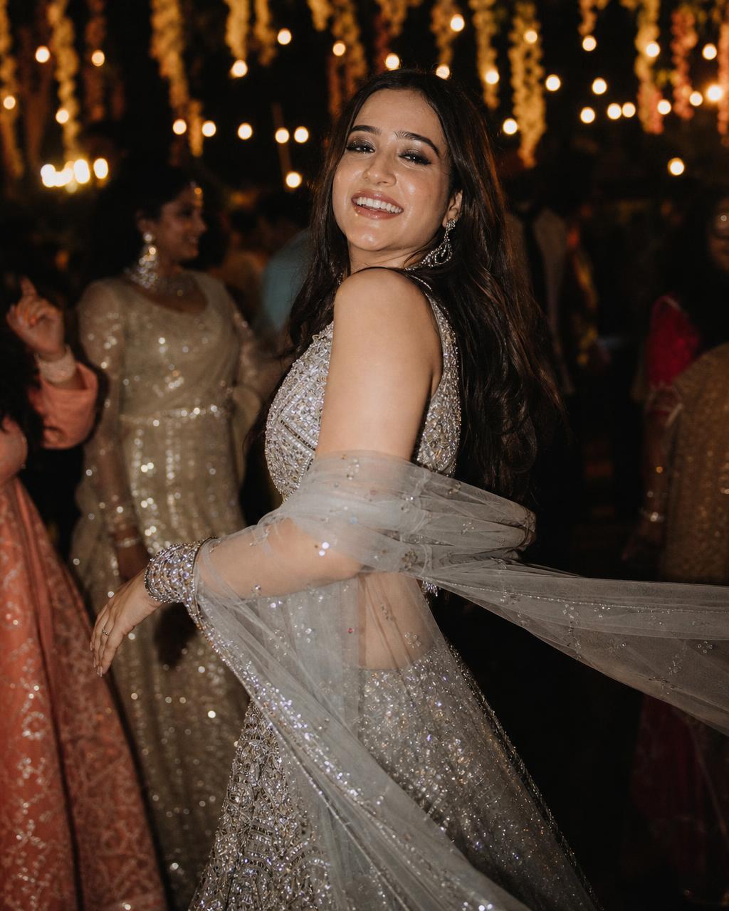 Bride with shimmery sangeet night makeup under event lighting