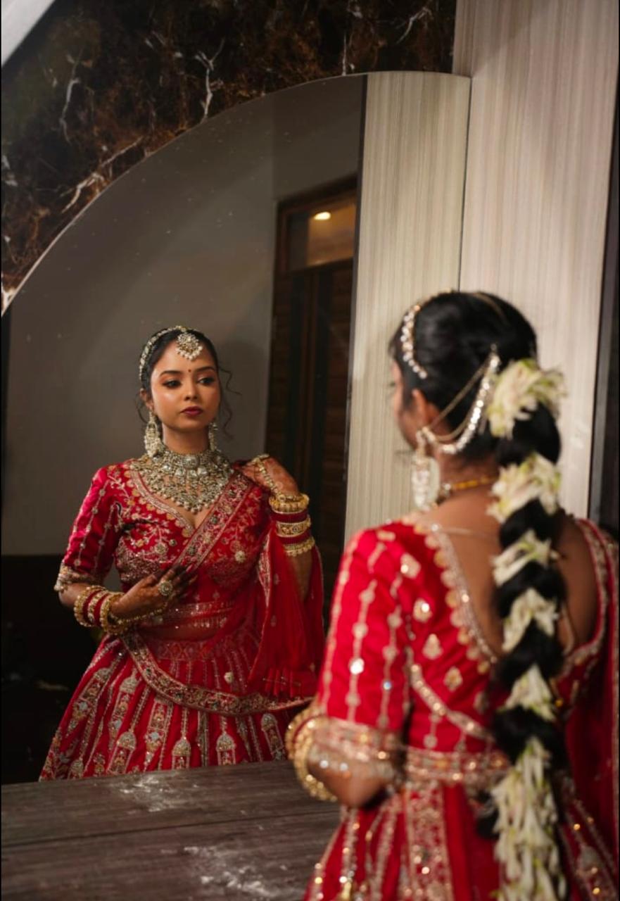 Client with soft engagement makeup and a red veil, styled by Aakanksha Makeovers